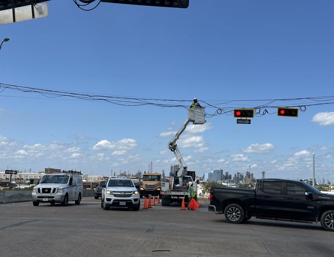 Span-wire signal work under traffic control